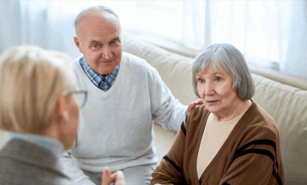 a wealth manager speaking to her older adult clients