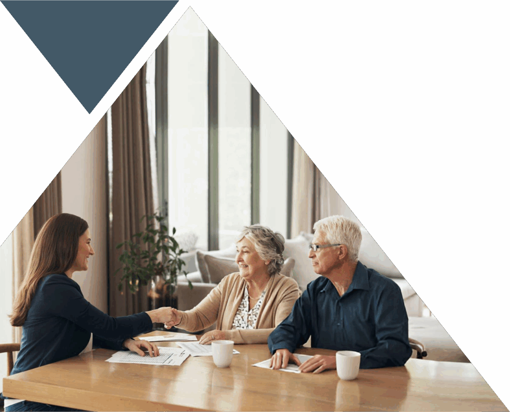 wealth advisor shaking hands with clients